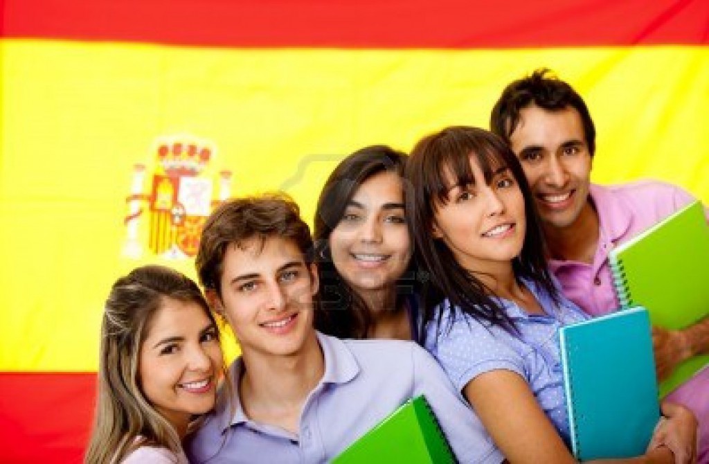 11465754-spanish-students-with-the-flag-of-spain-at-the-background